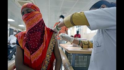 A beneficiary receives a dose of the COVID-19 vaccine, at Moti Lal Nehru Medical College, in Prayagraj. (ANI file Photo)