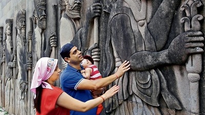 A Parsi couple prays to the guardians of the fire temple at Tardeo in Mumbai on Navroz. (Kunal Patil/Hindustan Times)
