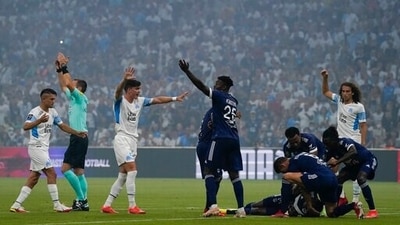 Bordeaux's Samuel Kalu lays on the pitch as players call the medic during the French League One soccer match between Marseille and Bordeaux at the Velodrome stadium in Marseille, southern France, Sunday, Aug. 15, 2021. (AP Photo/Daniel Cole) (AP) Bordeaux's Samuel Kalu lays on the pitch as players call the medic during the French League One soccer match between Marseille and Bordeaux at the Velodrome stadium in Marseille, southern France, Sunday, Aug. 15, 2021. (AP Photo/Daniel Cole) (AP)
