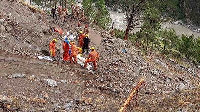 NDRF and ITBP jawans during a search operation at the landslide site near Nigulseri in Kinnaur, Himachal Pradesh. (HT Photo) NDRF and ITBP jawans during a search operation at the landslide site near Nigulseri in Kinnaur, Himachal Pradesh. (HT Photo)