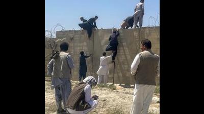 People try to enter Hamid Karzai International airport as they try to flee Kabul. (AFP) People try to enter Hamid Karzai International airport as they try to flee Kabul. (AFP)