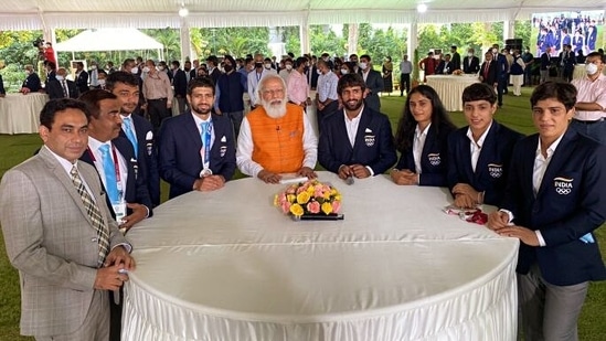 Prime Minister Narendra Modi with the Indian wrestling team during a meet with the Tokyo Olympics contingent, in New Delhi on Monday.(ANI)