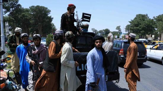 Taliban forces patrol a street in Herat, Afghanistan, on August 14. (Reuters)