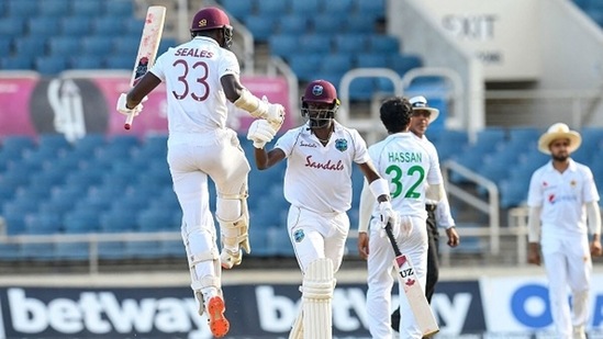Jayden Seales (L) and Kemar Roach of West Indies celebrate winning on Day 4 against Pakistan. (Getty Images)