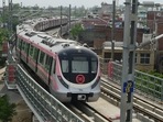 A metro train runs on a track after Delhi Metro's remaining portion of the Pink Line corridor was inaugurated, in New Delhi. A metro train runs on a track after Delhi Metro's remaining portion of the Pink Line corridor was inaugurated, in New Delhi.