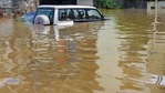 Bengaluru: A car submerged partially in a waterlogged area following heavy rains overnight.(PTI / File)
