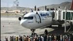 Afghan people climb atop a plane as they wait at the Kabul airport on August 16, trying to flee Taliban’s feared hardline brand of Islamist rule. (AFP) Afghan people climb atop a plane as they wait at the Kabul airport on August 16, trying to flee Taliban’s feared hardline brand of Islamist rule. (AFP)