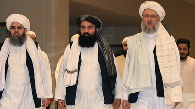 Khairullah Khairkhwa (centre) with other members of Taliban's negotiating team, in Doha. (AFP Photo) Khairullah Khairkhwa (centre) with other members of Taliban's negotiating team, in Doha. (AFP Photo)