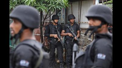 Members of Anti-Terrorism Squad (ATS) stand guard outside a house in Lucknow on July 11, 2021 (AFP Photo)