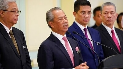 In this March 11, 2020, file photo, Malaysian Prime Minister Muhyiddin Yassin, center, speaks during a press conference after his first cabinet meeting at Prime Minister's Office in Putrajaya, Malaysia. (AP) In this March 11, 2020, file photo, Malaysian Prime Minister Muhyiddin Yassin, center, speaks during a press conference after his first cabinet meeting at Prime Minister's Office in Putrajaya, Malaysia. (AP)