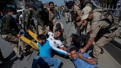Kashmiri Muslims react as they are detained by police as devotees defy restrictions for a Muharram procession in Srinagar. (AFP) Kashmiri Muslims react as they are detained by police as devotees defy restrictions for a Muharram procession in Srinagar. (AFP)