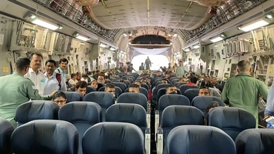 Indian diplomats and Indian journalists are seen inside the C-17 Globemaster before it took off from the Kabul airport. (MEA Photo) Indian diplomats and Indian journalists are seen inside the C-17 Globemaster before it took off from the Kabul airport. (MEA Photo)