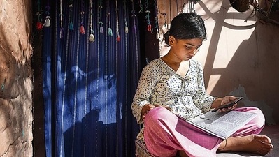 Khushi, a Class 9 student, attends her online class using the free Wi-Fi facility provided by the Delhi government at Mayapuri. (Sanchit Khanna/HT PHOTO) Khushi, a Class 9 student, attends her online class using the free Wi-Fi facility provided by the Delhi government at Mayapuri. (Sanchit Khanna/HT PHOTO)