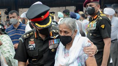 An Indian Army officer consoles Kamaljeet Kaur, the mother of Lt Colonel Abheet Singh Batth, during his funeral in Amritsar on Tuesday. (PTI) An Indian Army officer consoles Kamaljeet Kaur, the mother of Lt Colonel Abheet Singh Batth, during his funeral in Amritsar on Tuesday. (PTI)