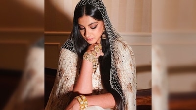 Instead of draping a heavily embroidered dupatta over her head, Rhea opted for a vintage pearl veil from Birdhichand Ghanshyamdas. (Instagram/@rheakapoor)