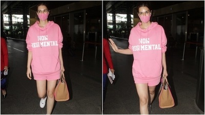 Kriti, on the other hand, opted for a monotone look for her arrival in Mumbai. She wore a blush pink oversized sweatshirt and shorts for the airport look. The droopy sleeves and loose silhouette of the hoodie added a laidback vibe to her outfit. (Varinder Chawla) Kriti, on the other hand, opted for a monotone look for her arrival in Mumbai. She wore a blush pink oversized sweatshirt and shorts for the airport look. The droopy sleeves and loose silhouette of the hoodie added a laidback vibe to her outfit. (Varinder Chawla)
