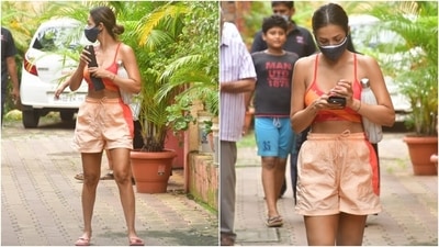 Malaika teamed the outfit with flip flops, a black face mask and a middle-parted sleek bun. She flaunted an au-naturel look with the attire and kept things simple. (Varinder Chawla) Malaika teamed the outfit with flip flops, a black face mask and a middle-parted sleek bun. She flaunted an au-naturel look with the attire and kept things simple. (Varinder Chawla)