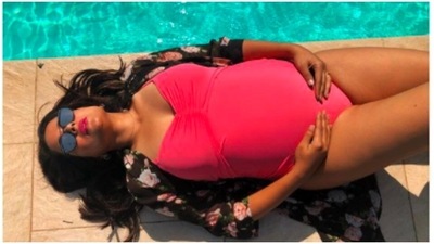 Sameera Reddy: This bold and stylish mom redefined maternity fashion as she posed in this pink swimwear flaunting her baby bump. (Instagram/@sameerareddy)