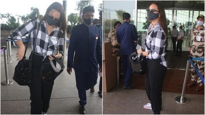 Sonakshi carried a black shoulder bag with her attire. She completed the look with a black face mask, vintage sunglasses, lace-up shoes, a watch and middle-parted open tresses. (Varinder Chawla) Sonakshi carried a black shoulder bag with her attire. She completed the look with a black face mask, vintage sunglasses, lace-up shoes, a watch and middle-parted open tresses. (Varinder Chawla)