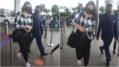 Sonakshi was snapped at the airport in a black and white check-print collared shirt with button-up details and a front knot. She teamed the long-sleeved shirt with high-waist black joggers that had gathered hems. (Varinder Chawla) Sonakshi was snapped at the airport in a black and white check-print collared shirt with button-up details and a front knot. She teamed the long-sleeved shirt with high-waist black joggers that had gathered hems. (Varinder Chawla)