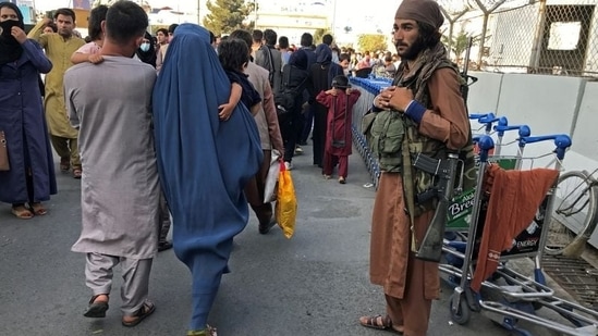 A Talib stands guard at the entrance of Hamid Karzai International Airport in Afghanistan's capital Kabul on Tuesday. (REUTERS)