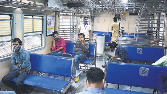 Fully vaccinated commuters travel by local train in Thane on Tuesday. (Praful Gangurde / HT Photo)
