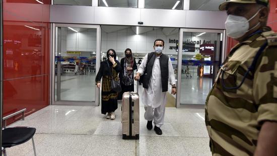 Passengers from Kabul, Afghanistan, arrive at T3 Indira Gandhi International Airport in New Delhi on Sunday, August 15. (Sanjeev Verma/HT photo)