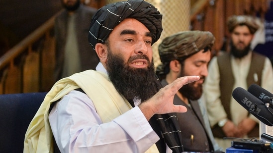 Taliban spokesperson Zabihullah Mujahid gestures as he speaks during the first press conference in Kabul on Tuesday following the Islamist group's stunning takeover of Afghanistan.(Hoshang Hashimi / AFP)