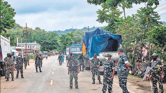 File photo: CRPF personnel stand guard at the national highway in Lailapur area near Assam-Mizoram border on August 1. (AFP)