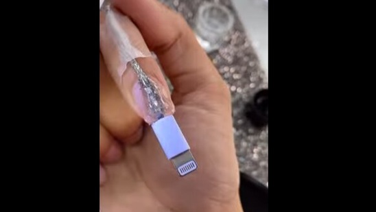 The image shows the phone charger nails.(Twitter/@ ilysmnails) The image shows the phone charger nails.(Twitter/@ ilysmnails)