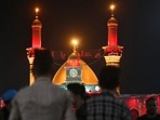 Iraqi Shiite Muslims take part in a mourning procession during the month of Muharram leading up to the day of Ashura, at the Imam Abbas shrine in Iraq's holy city of Karbala(Photo by Mohammed SAWAF/AFP) Iraqi Shiite Muslims take part in a mourning procession during the month of Muharram leading up to the day of Ashura, at the Imam Abbas shrine in Iraq's holy city of Karbala(Photo by Mohammed SAWAF/AFP)