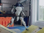 The images shows a robot attempting a parkour obstacle course.