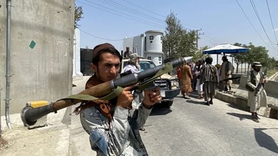 A Taliban fighter holds a rocket propelled grenade as he stands guard at an entrance gate outside the interior ministry in Kabul on Tuesday. (AFP Photo) A Taliban fighter holds a rocket propelled grenade as he stands guard at an entrance gate outside the interior ministry in Kabul on Tuesday. (AFP Photo)