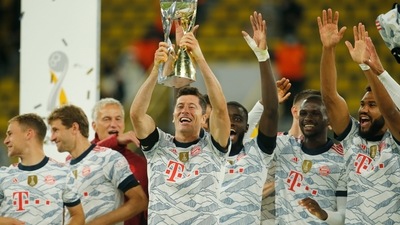 DFL Super Cup - Borussia Dortmund v Bayern Munich - Signal Iduna Park, Dortmund, Germany - August 17, 2021 Bayern Munich's Robert Lewandowski and teammates celebrate winning the DFL Super Cup with the trophy (REUTERS)