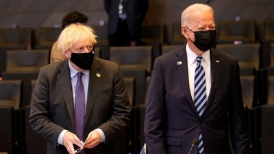 Britain's prime minister Boris Johnson (left) stands next to US president Joe Biden during a plenary session at a NATO summit in Brussels, Belgium, on June 14, 2021. (File Photo / REUTERS)