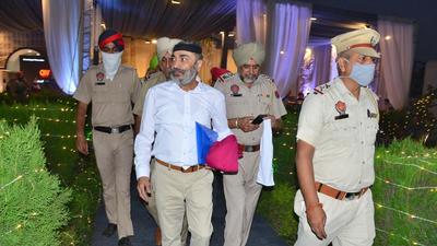 UCPMA president DS Chawla being escorted out after his turban was allegedly tossed during the annual general meeting in Ludhiana on Wednesday. (Gurpreet Singh/HT) UCPMA president DS Chawla being escorted out after his turban was allegedly tossed during the annual general meeting in Ludhiana on Wednesday. (Gurpreet Singh/HT)