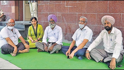 Employees protesting outside the BSNL office in Ludhiana on Wednesday. (Gurpreet Singh/HT)