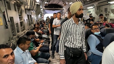 Indians sit aboard an Indian military aircraft at the airport in Kabul (AFP) Indians sit aboard an Indian military aircraft at the airport in Kabul (AFP)
