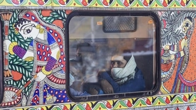 A passenger onboard a train at New Delhi Railway Station (PTI File) A passenger onboard a train at New Delhi Railway Station (PTI File)
