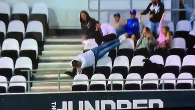 Fan falls over empty seats while catching Livingstone's massive six, manages to save his phone - VIDEO (Screengrab/Twitter) Fan falls over empty seats while catching Livingstone's massive six, manages to save his phone - VIDEO (Screengrab/Twitter)