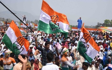 Congress supporters with Congress flags ahead of a rally. (File)