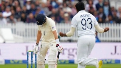 India's Jasprit Bumrah celebrates after taking the wicket of England's Joe Root caught by India's Virat Kohli during the fifth day of the 2nd cricket test between England and India at Lord's cricket ground in London, Monday, Aug. 16, 2021. (AP)