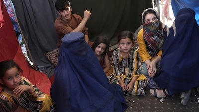 Women from Takhar province sit inside their tent in a public park in Kabul. (AP Photo) Women from Takhar province sit inside their tent in a public park in Kabul. (AP Photo)