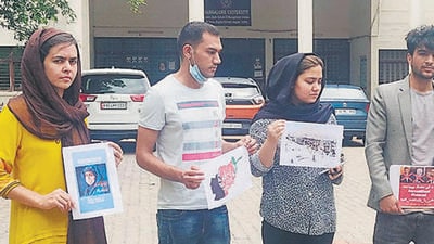Afghan students protest outside Bangalore University against the Taliban on Tuesday. (HT Photo) Afghan students protest outside Bangalore University against the Taliban on Tuesday. (HT Photo)