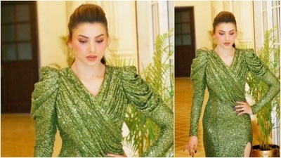 Urvashi Rautela recently took to her Instagram handle to share this gorgeous picture of herself in a shimmery green thigh-high slit gown. (Instagram/@urvashirautela)