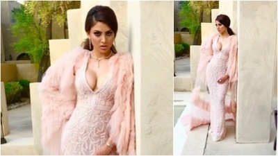 Urvashi Rautela wore this body-hugging embellished evening dress for an award show. The plunging neckline and the cape added more charm to her look. (Instagram/@urvashirautela)