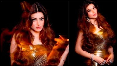Urvashi Rautela looks drop-dead gorgeous in this golden metallic gown. She accessorised her look with diamond rings, bracelets and long stone earrings. (Instagram/@urvashirautela)