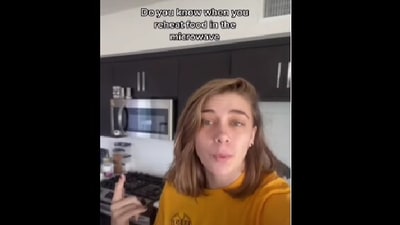 The image shows the woman talking about microwave hacks. (YouTube/@onlyjayus)
