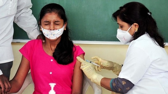 A healthcare worker inoculates a dose of the vaccine against coronavirus to a beneficiary. (ANI) A healthcare worker inoculates a dose of the vaccine against coronavirus to a beneficiary. (ANI)