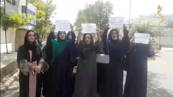 A group of women hold a street protest calling on the Taliban to protect their rights, in Kabul, Afghanistan, on August 17. (SHAMSHAD NEWS via REUTERS)